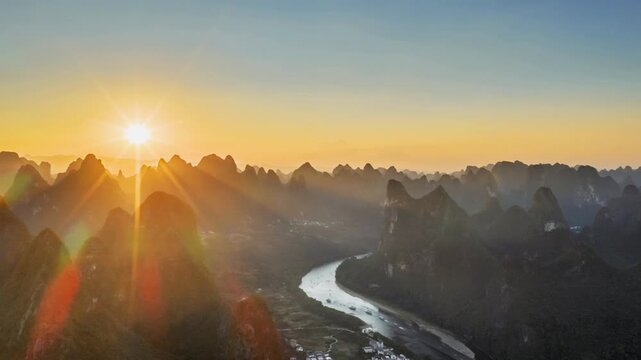 aerial time-lapse of a stunning sunset over the Li River and karst mountains in Yangshuo, Guilin, China