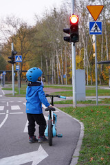 a young cyclist waiting at a red light