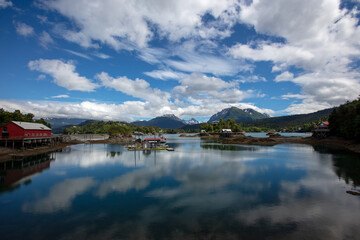 Fototapeta premium Dramatic sky and clouds reflecting water in Halibut Cove Alaska United Statesd