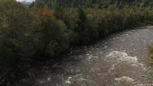 Aerial View of Large Turbulent Mountain River Flowing Fast