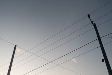 Power electric pole with line wire on colored background close up, photography consisting of power...