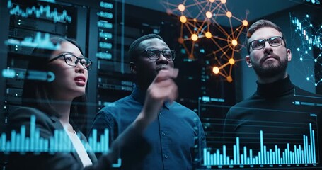 Diverse team of IT professionals analyzing big data and financial charts on futuristic holographic interface in server room, cyber security concept - Powered by Adobe
