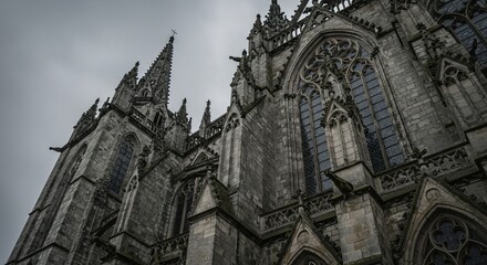 Fototapeta premium Dramatic Gothic Cathedral Architecture in France – Stunning Stone Exterior & Religious Landmarks Photography