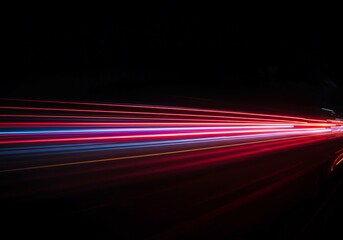 Vibrant neon streaks illuminate the darkness, forming dynamic lines of energy and high-speed movement across the intense night scene backdrop, curve, colorful, electric