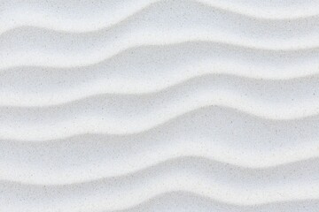 Obraz premium Sandy texture with gentle waves on a beach-like surface, creating a soothing visual effect.