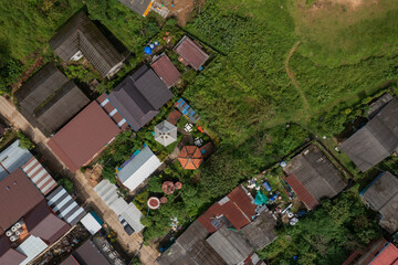 Obraz premium E-Tong Village (or Baan E-Tong) in Kanchanaburi is a charming, misty village near the Thai-Myanmar border. Aerial view from a drone.