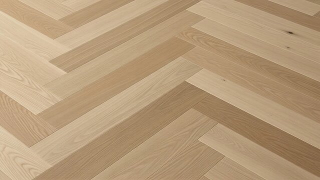 Light brown oak hardwood flooring laid in a classic herringbone pattern, showing natural wood grain and texture.