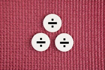 Three white circles with a division symbol. division concept. means divide which is the opposite of multiplication. Education concept.