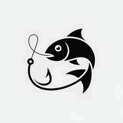 Fototapeta premium A sleek black silhouette of a fish caught on a fishing hook