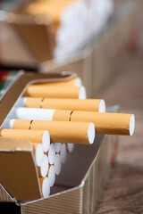 Close up of open pack of cigarettes on table