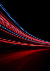 Dynamic long exposure photograph capturing vibrant red and blue light trails streaming across a dark, abstract background, suggesting high-speed movement, long exposure, electric, design element