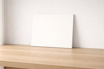 Blank Frame Mockup on Wooden Table Against White Wall in Minimal Interior, Clean Background for Branding, Product Display and Design Presentation