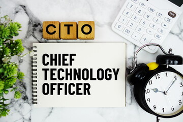 CTO Chief Technology Officer text with calculator and alarm clock on marble background