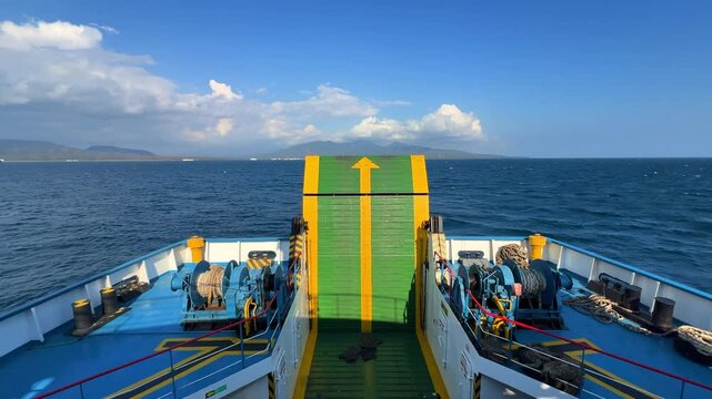 Bali, Indonesia - August 27, 2025: Car and passenger ferries cross the Bali Strait from Gilimanuk Harbor to Ketapang Harbor. View of the strait from the ferry deck. 4К