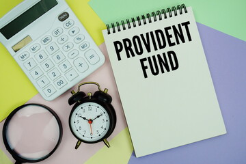 Provident Fund text with calculator, alarm clock and magnifying glass