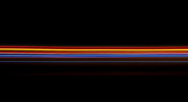 Faint colorful streaks across a dark background, illustrating motion and the lingering presence of captured energy during exposure, mystic, long exposure, light trail