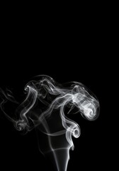 Thick white vapor swirling and rolling across a completely isolated black background, creating an abstract and mysterious texture effect, isolation, flow, atmospheric