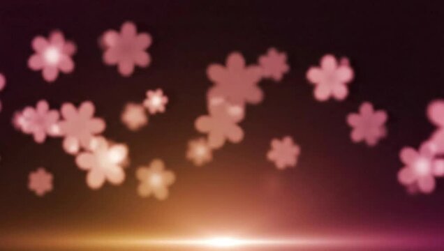 Abstract floral bokeh background with glowing light.