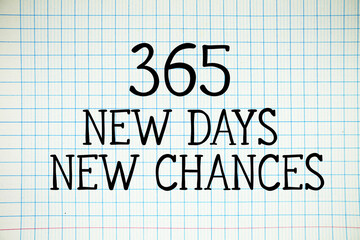 365 New Days New Chances text written on white notebook sheet with grid