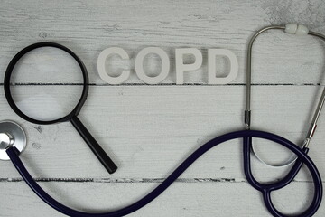 COPD Chronic Obstructive Pulmonary Disease text with Stethoscope on wooden background