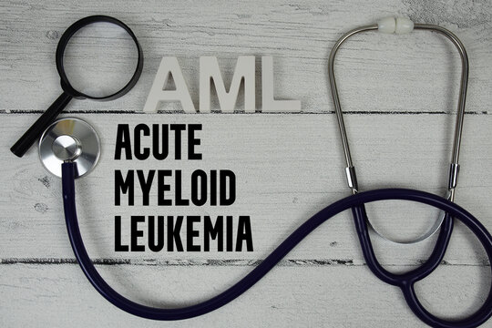 AML Acute Myeloid Leukemia text with Stethoscope on wooden background