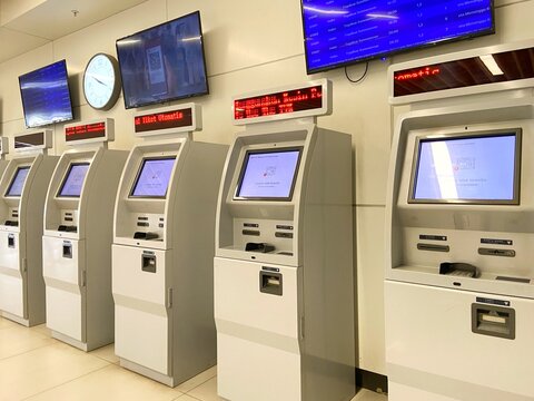 Jakarta, Indonesia - October 12, 2025: A row of modern, self-service ticket vending machines operating in the clean, well-lit interior of the Halim High-Speed Rail Station in Jakarta, Indonesia.