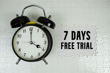 7 Days Free Trial text with alarm clock on white background