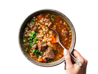 Beef barley soup with hearty ingredients held by woman&rsquo;s hand isolated on transparent background