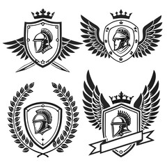 Obraz premium elegant laurel wreaths, shields, wings, and ribbon vector set.black-and-white vector pack of wreaths, shields, banners, and wings .Collection of six heraldic emblems with shields laurels helmet.