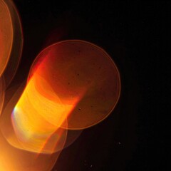 Blurry orbs of light radiate, overlapping against a dark background