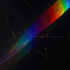 Prism rainbow effect on scratched, black surface