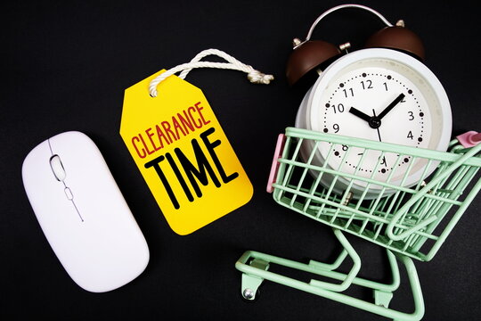 Clearance Time text with price tag, optical mouse, trolly cart and alarm clock on black background, Shopping Online Concept