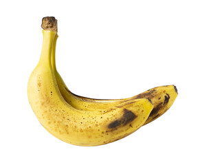 Ripe yellow bananas with brown spots isolated on white background, showing natural texture and freshness.