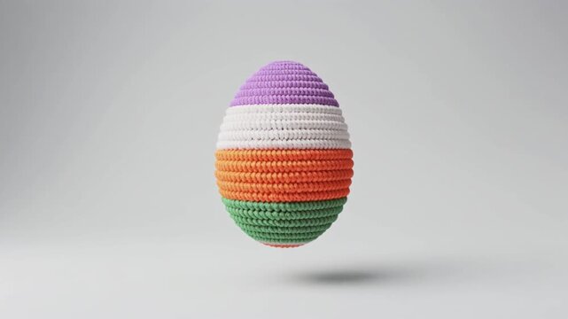 Colorful crochet easter egg on isolated white background.