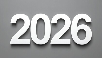 The bold white numbers "2026" are simply and clearly displayed with subtle shadows on a clean, solid gray background.