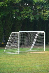 goal of football on green grass background, object of sport