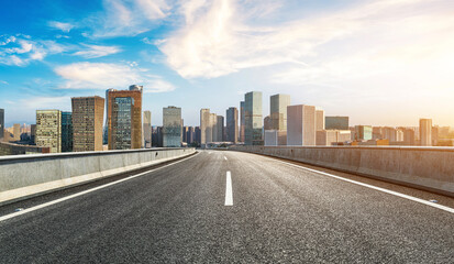 Empty asphalt highway road and city skyline with modern buildings in Hangzhou