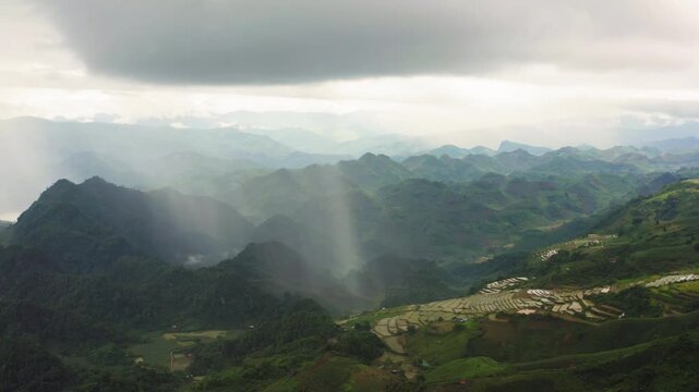 Mộc Ch&acirc;u, towering cumulonimbus clouds act as hydrological pumps, releasing concentrated rain shafts that rapidly feed lateau&rsquo;s limestone rapids and tiered waterfalls, Xuan Nha Nature Reserve.