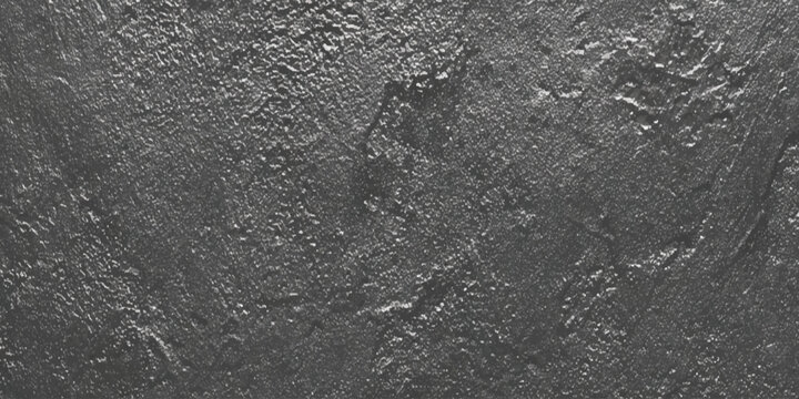 A stark monochromatic image displays a highly textured surface resembling weathered rock or abstract dark matter
