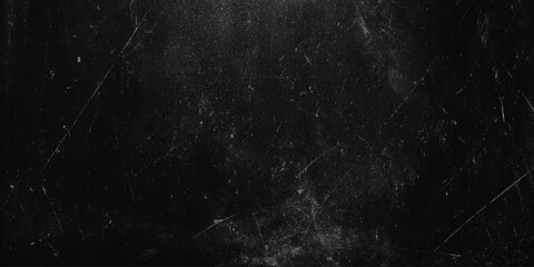 A dark and grainy texture with scratches and imperfections across a black surface creating a distressed aesthetic