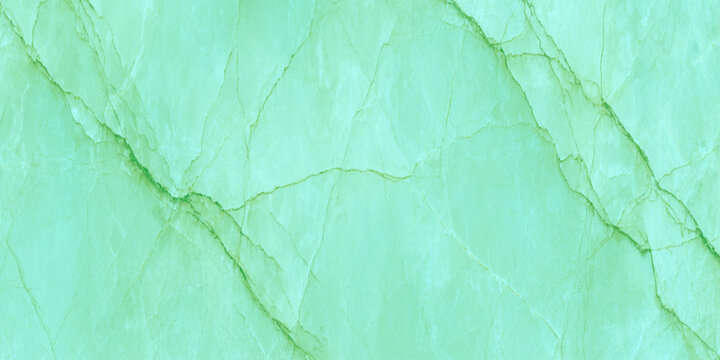 A close up view of a vibrant green marble stone surface showcasing natural veining and a textured polished appearance