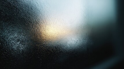 Frosted Textured Glass Surface with Golden Light Reflection and Subtle Blue Hues - Abstract Background.