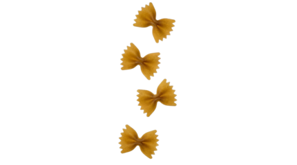 Four pieces of uncooked whole wheat farfalle pasta floating vertically on transparent background