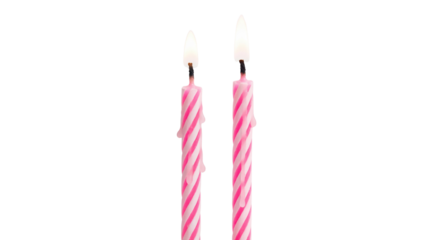 Two slender pink and white striped birthday candles burning brightly on transparent background