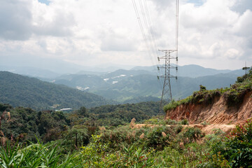 Obraz premium Power Lines Over Mountain Landscape in the Cameron Highlands