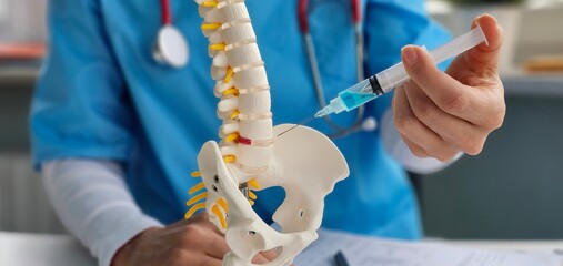 Injection from a syringe with an anesthetic drug into an intervertebral disc herniation,