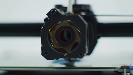 3d Printing Nozzle Extruding Blue Object on White Surface Close Up