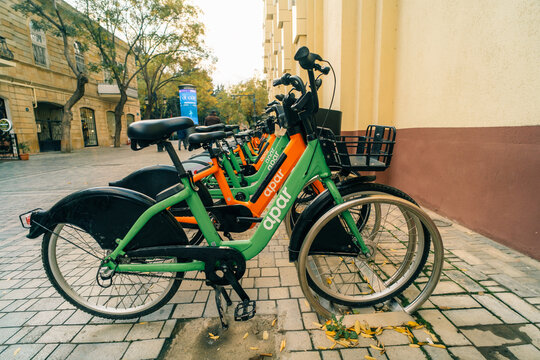 Part of the city smart urban mobility. Apar shared bikes parked in a public park in Baku, Azerbaijan - 1 dec 2025