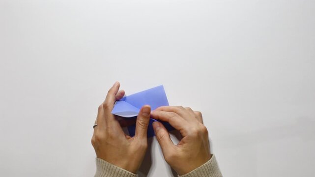 Folding from Triangle to Square &ndash; Basic Origami Crane Step