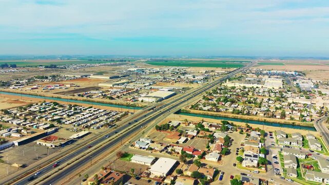 Aerial view of western Calexico showing streets, housing blocks, and desert environment with wide urban perspective.